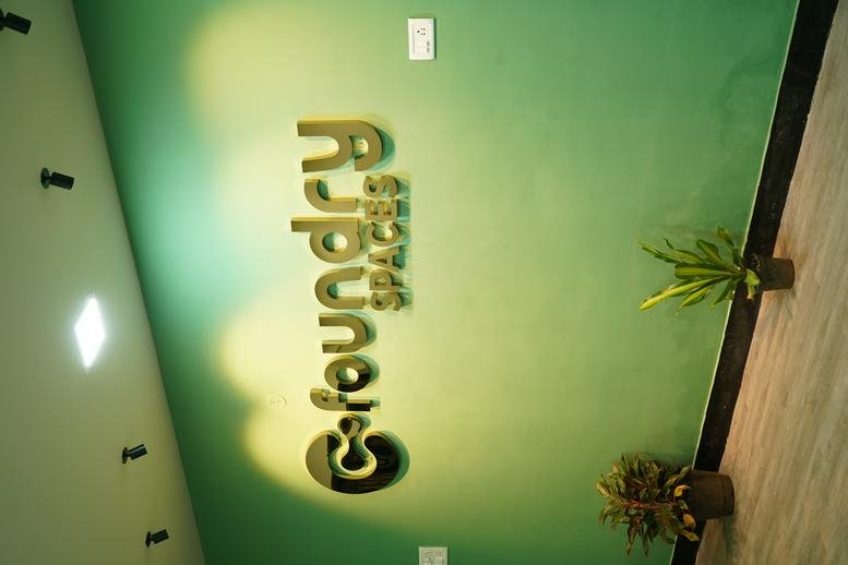 Exterior view of Foundry Spaces office building entrance with signage.