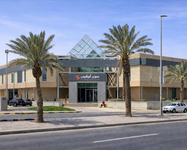 Exterior view of the modern Khurais Branch Road building featuring a distinct glass pyramid roof.