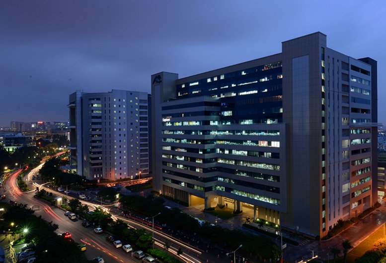 Exterior dusk view of the modern Maximus Tower 2A Raheja Mindspace IT Park Madhapur building.