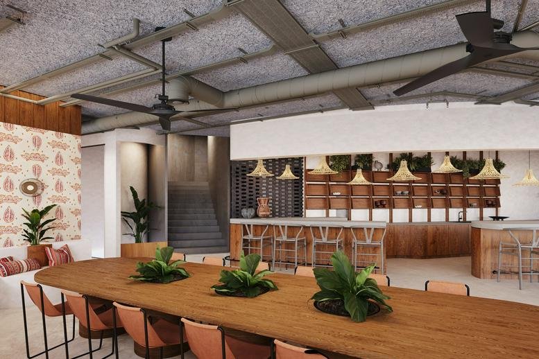 Spacious communal dining area with long wooden tables and woven pendant lights at 25 HaMered Street, Neve Tzedek.