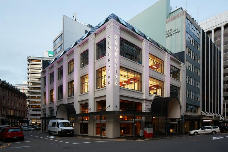 Exterior view of the character building at 30 Waring Taylor Street with illuminated windows at dusk.