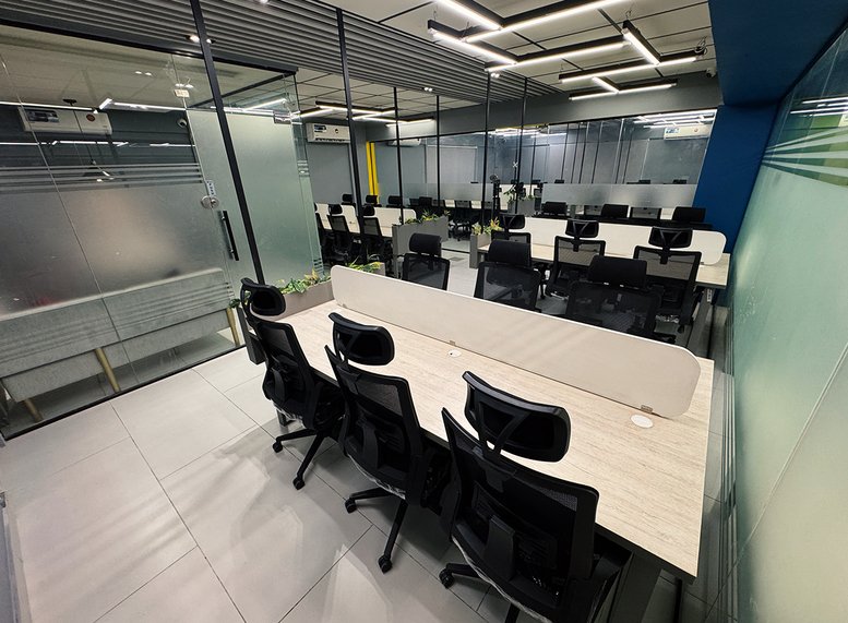 Open-plan office space with modern desks and chairs.