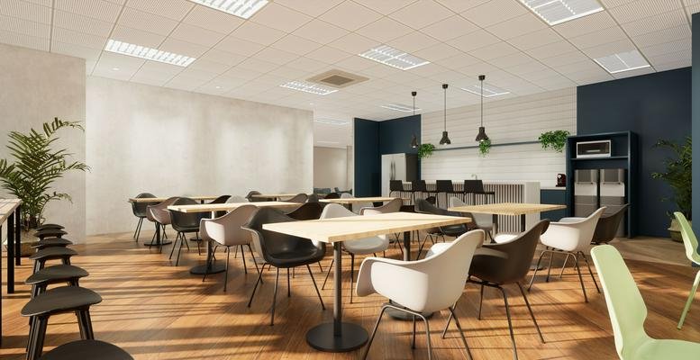 Spacious communal dining area at 9F Johndorf Tower with wooden floors and a modern kitchen background.
