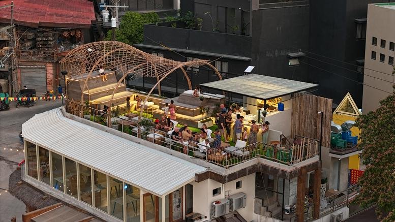 Exterior view of the rooftop terrace at Calle Hama, Townsquare, El Nido, featuring a woven bamboo structure.