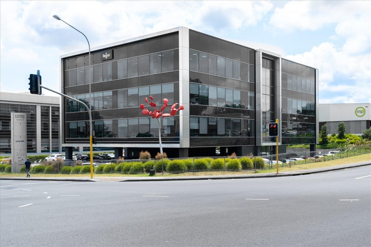 Exterior view of the glass-facade Candida Building 4 at 61 Constellation Drive.