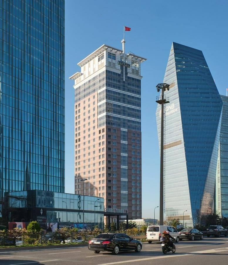 Exterior view of the modern glass and masonry Tekfen Tower.