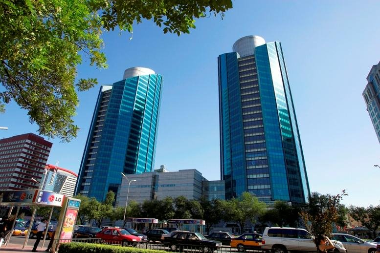 Exterior view of the blue glass Twin Towers at B-12 Jianguomenwai Avenue.