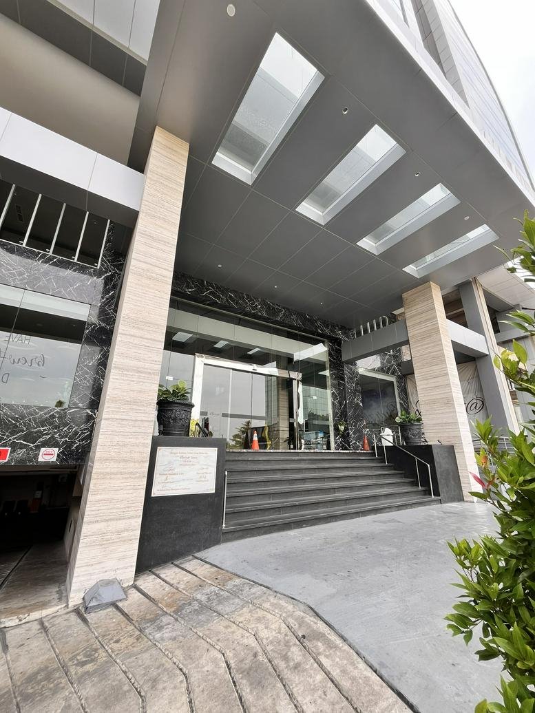 Modern exterior entrance of the building at Jl. Pantai Indah Selatan No. 8.
