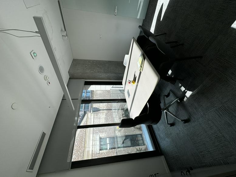 Open-plan office space at Kennedy Cd. No: 54 M1 M2 M3 M4 Blok with white desks and city views.