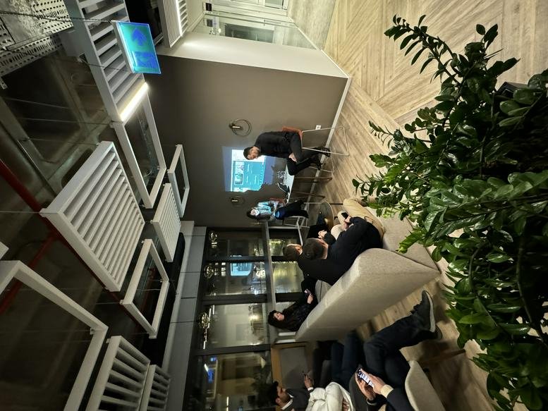 The modern coworking interior at Kennedy Cd. No: 54 M1 M2 M3 M4 Blok with vibrant green plants and lounge seating.
