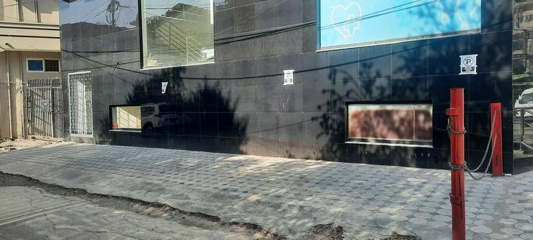 Street-level exterior view of the modern glass building at Satellite Town, D Block, Rawalpindi.