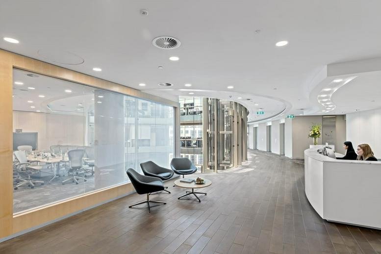 Spacious reception area at 1 Bligh Street, Level 26, featuring curved desks and glass-walled meeting rooms.
