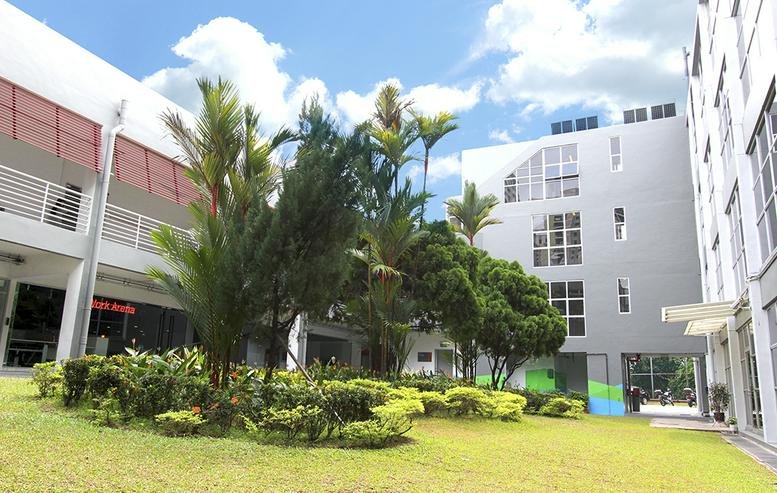 Exterior view of the white and grey building facade at 10 Raeburn Park.