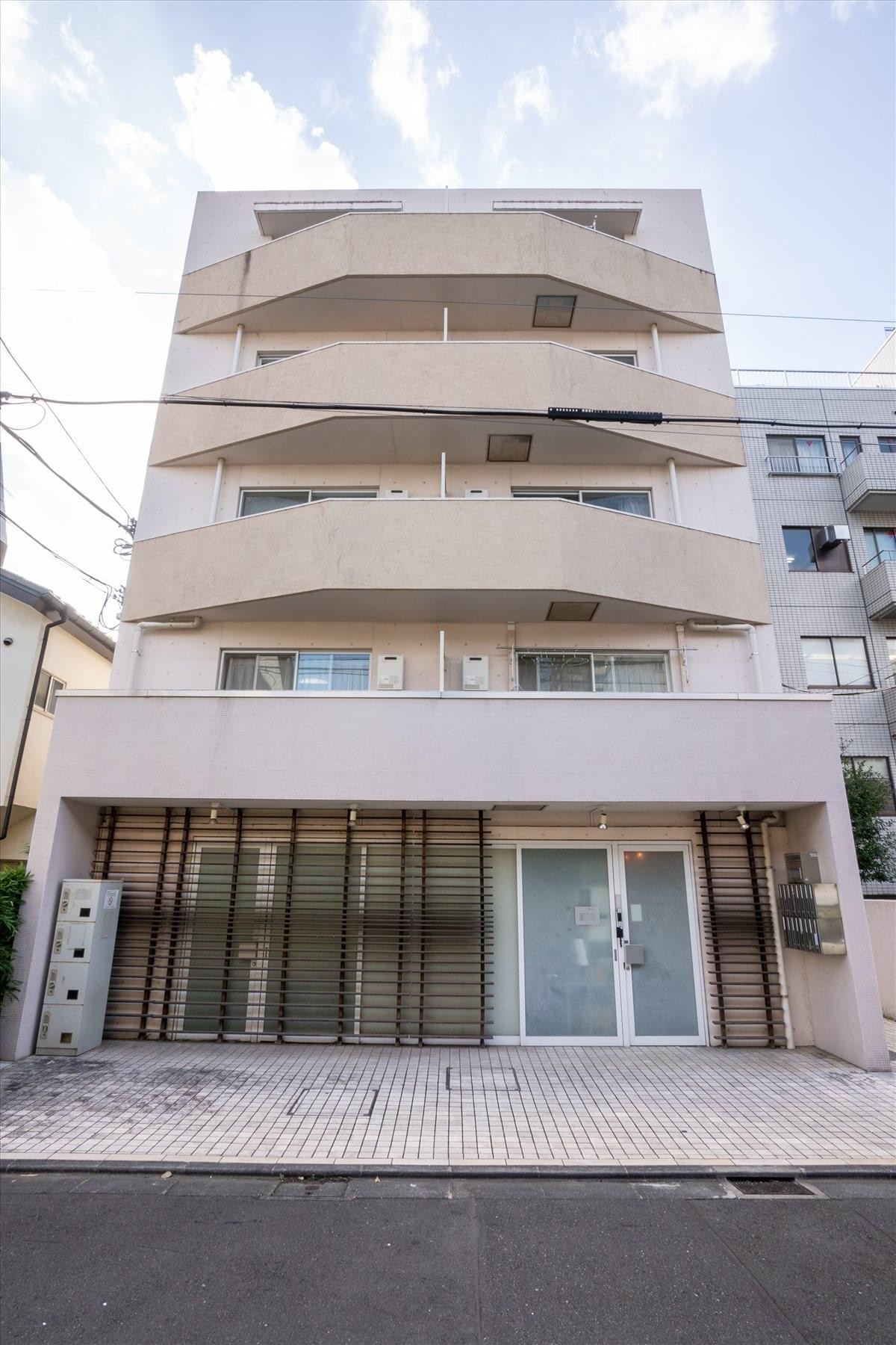 Exterior view of the multi-story Azabu East Court, Higashi Azabu, Tokyo building with modern balconies.