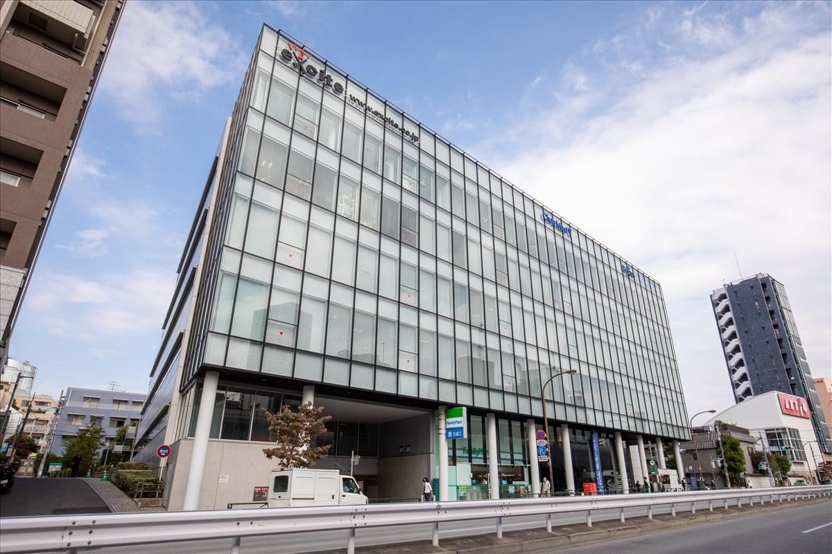 Exterior view of the glass-facade Azabu Green Terrace building in Tokyo.