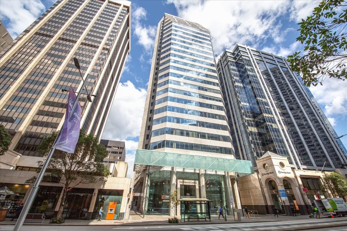 Exterior view of the soaring glass and stone facade at Forrest Centre, 221 St. Georges Terrace.