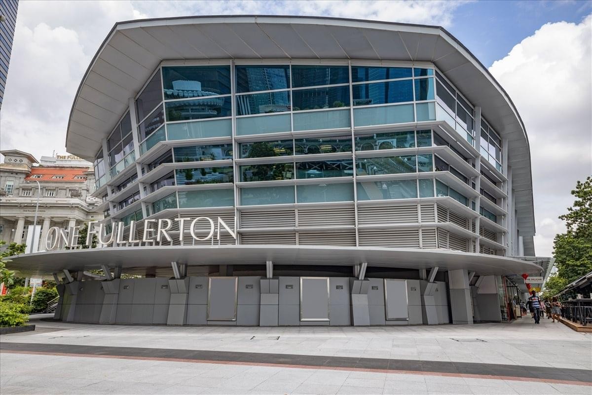 Modern glass and steel exterior facade of the One Fullerton building.