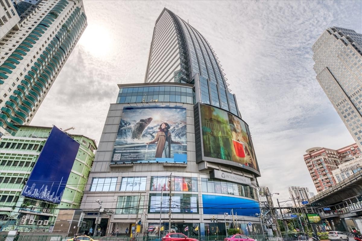 The glass-facade Interchange 21 skyscraper at the Asoke and Sukhumvit Road intersection.