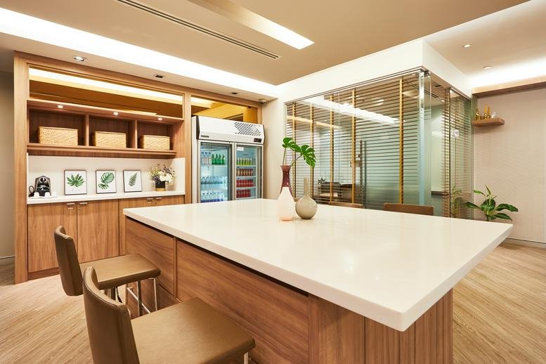 Sathorn Thani Building 1 breakroom with wooden cabinets and a central island.