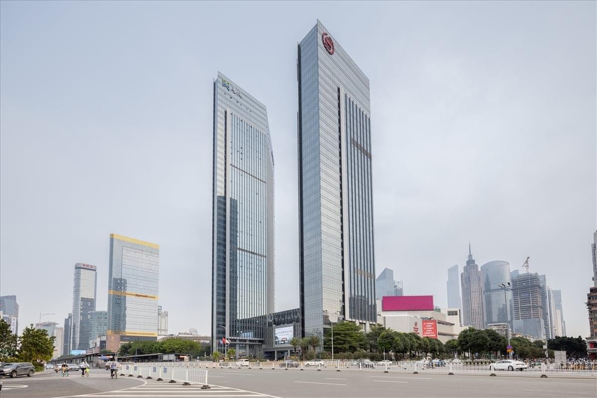 Exterior view of the soaring glass-facade skyscrapers of Teem Tower in Guangzhou.
