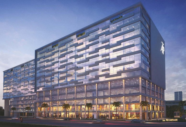 Dusk view of the modern glass facade at Redbrick Offices, Amar Tech Park, Balewadi with lighted ground floor retail.
