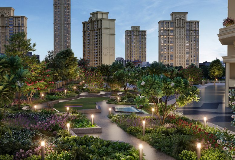 Landscaped garden pathways with warm lighting and greenery at Redbrick Offices, Centaurus, Hiranandani Business Park.