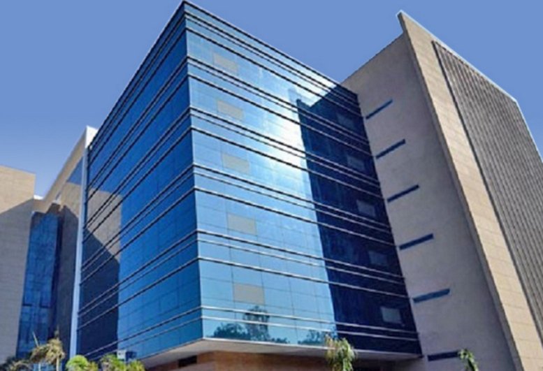 Exterior facade of the blue glass and stone Redbrick Offices, Kalpataru, Wagle Estate.