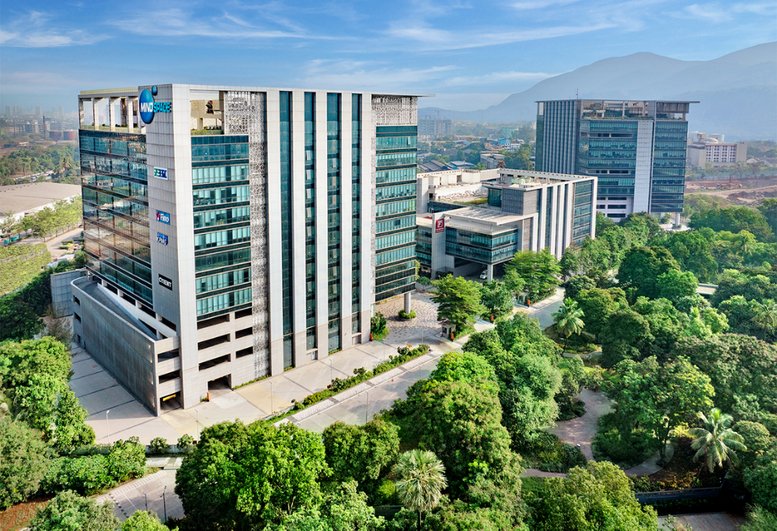 High-angle exterior view of the modern glass buildings at Redbrick Offices, Mindspace Juinagar.