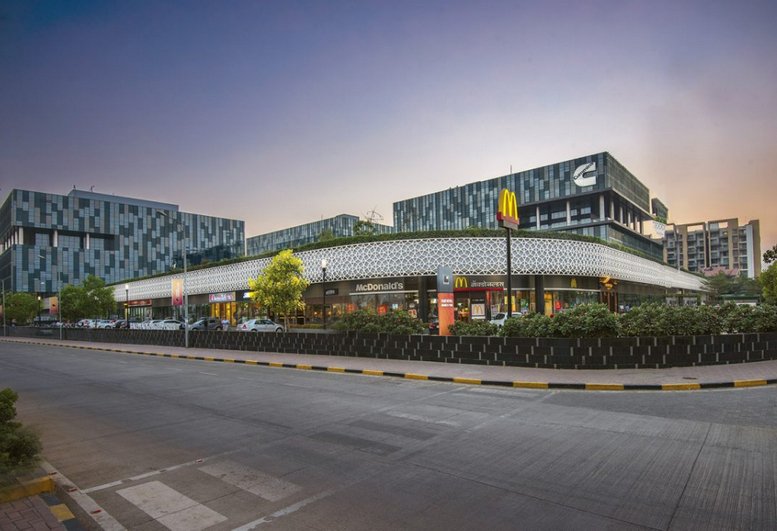 Exterior view of the modern patterned facade at Redbrick Offices, Panchshil Business Park.