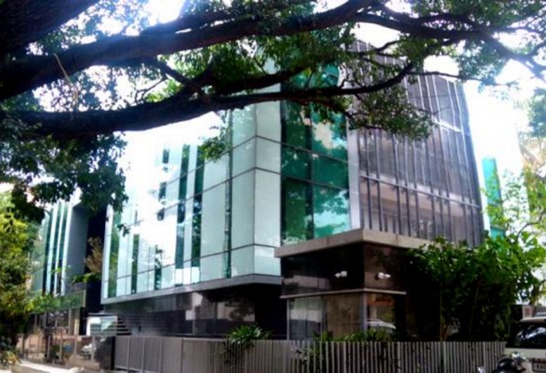 Exterior view of the modern glass-facade at Redbrick Offices, Prestige Tristar, Mg Road.