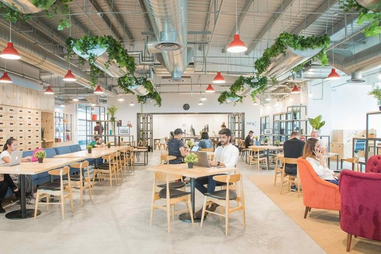 Spacious communal coworking lounge at 1 Kallang Junction, Level 6, Vanguard Campus.