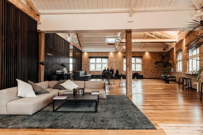 Spacious interior lobby with wooden floors and beams at Level 4, 1 Kenwyn Street, Parnell, Auckland.
