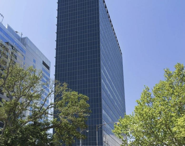 Exterior view of the dark glass facade skyscraper at 1 Nicholson Street.