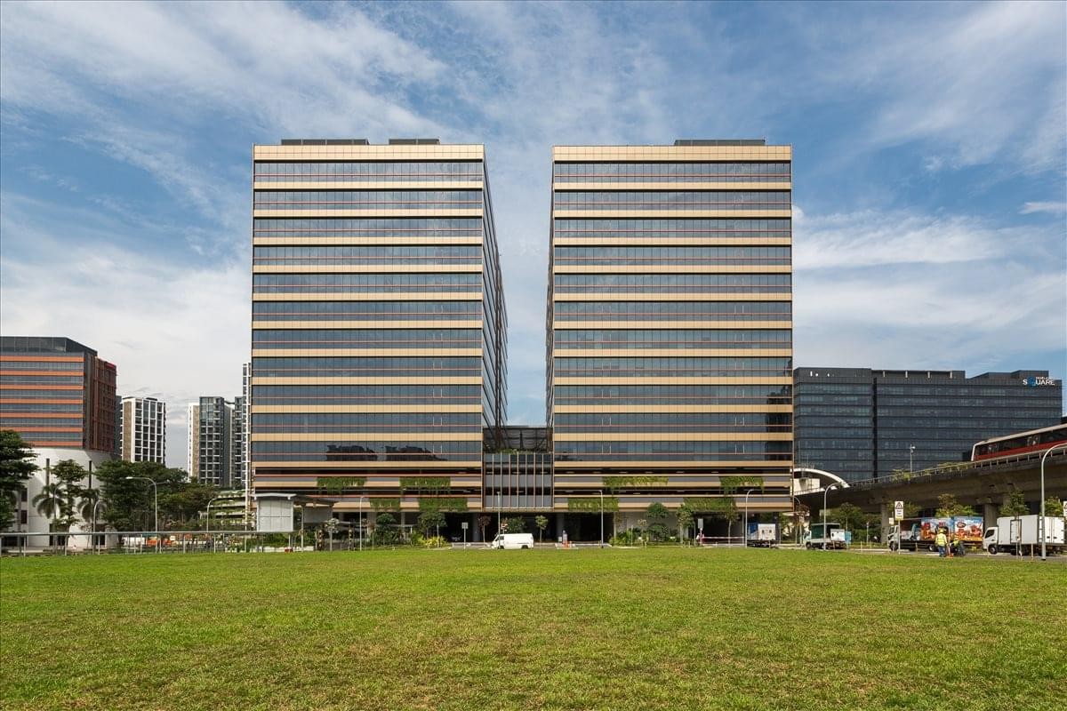Exterior view of the modern twin towers at 1 Paya Lebar Link, Paya Lebar Quarter.
