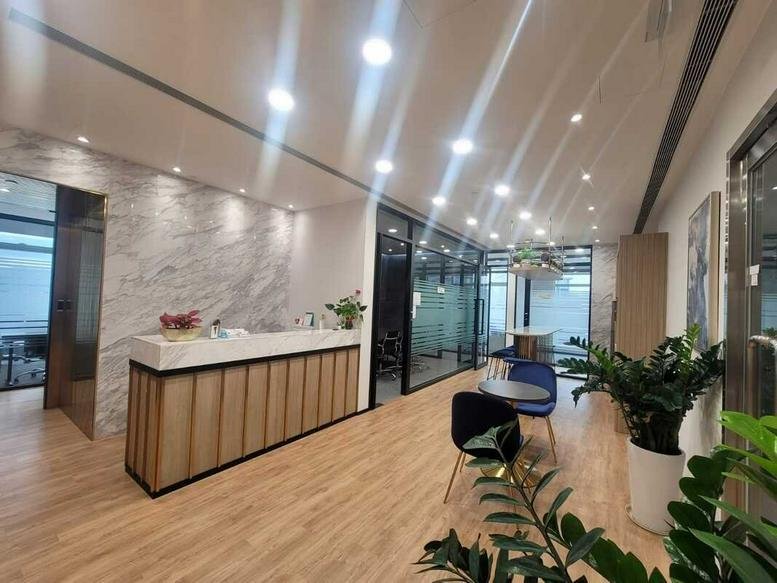 Modern lobby at 10 Shing Yip Street Unit A with a wood-paneled reception desk and marble feature wall.