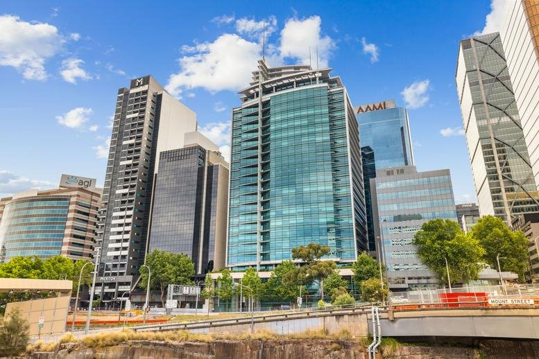Exterior view of the high-rise glass facade building at 100 Arthur Street.