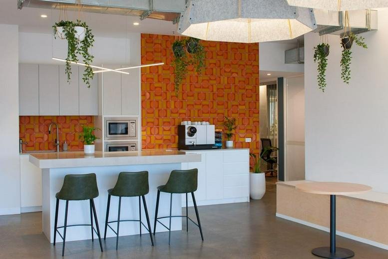 Modern kitchen and breakout area at Level 2 & 3, 100 Cubitt Street, Cremorne, Melbourne, Victoria.