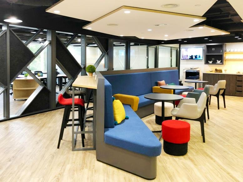 Spacious communal lounge at Silvercord Tower 2, Levels 5, 11 & 17, with colorful booths and modern lighting.
