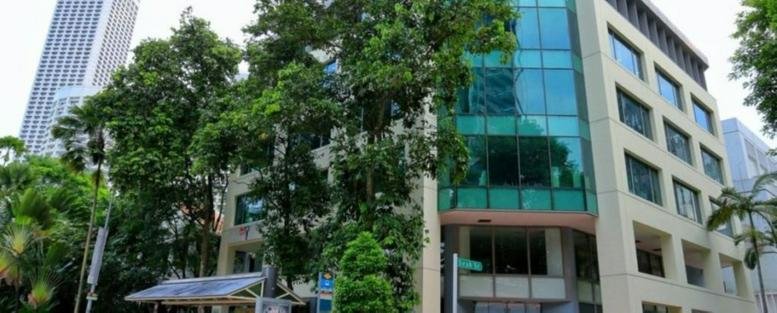 Exterior view of the glass-facade Crasco Building at 11 Beach Road.