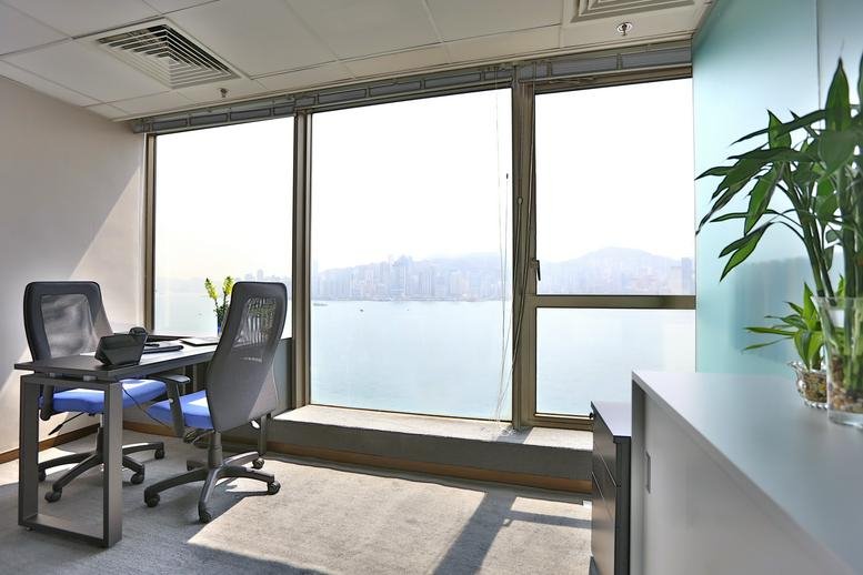 Private office at Wing On Plaza with desks and expansive harbor views.