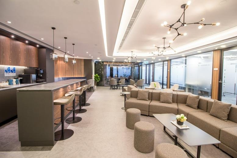 Spacious modern lounge at Level 27 Wing On Centre with a sleek bar area and designer lighting.