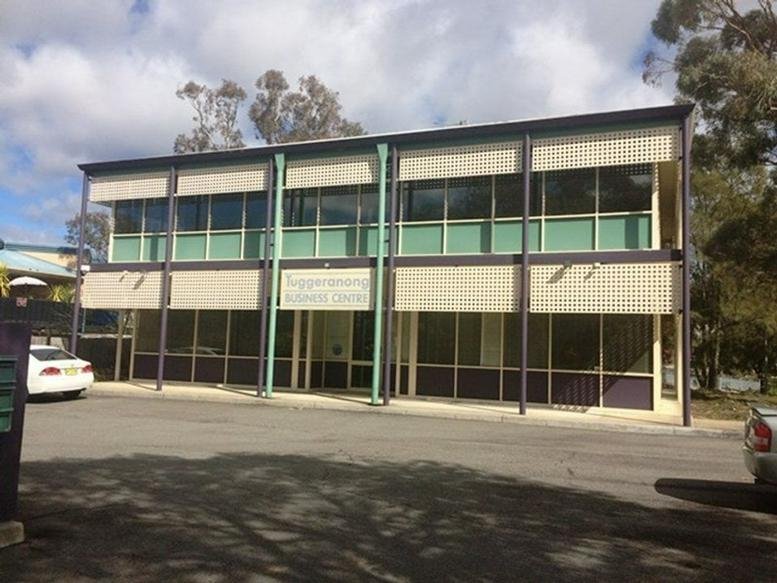 Exterior view of the two-story office building at 12 Kett Street, Kambah, Canberra, Australian Capital Territory.