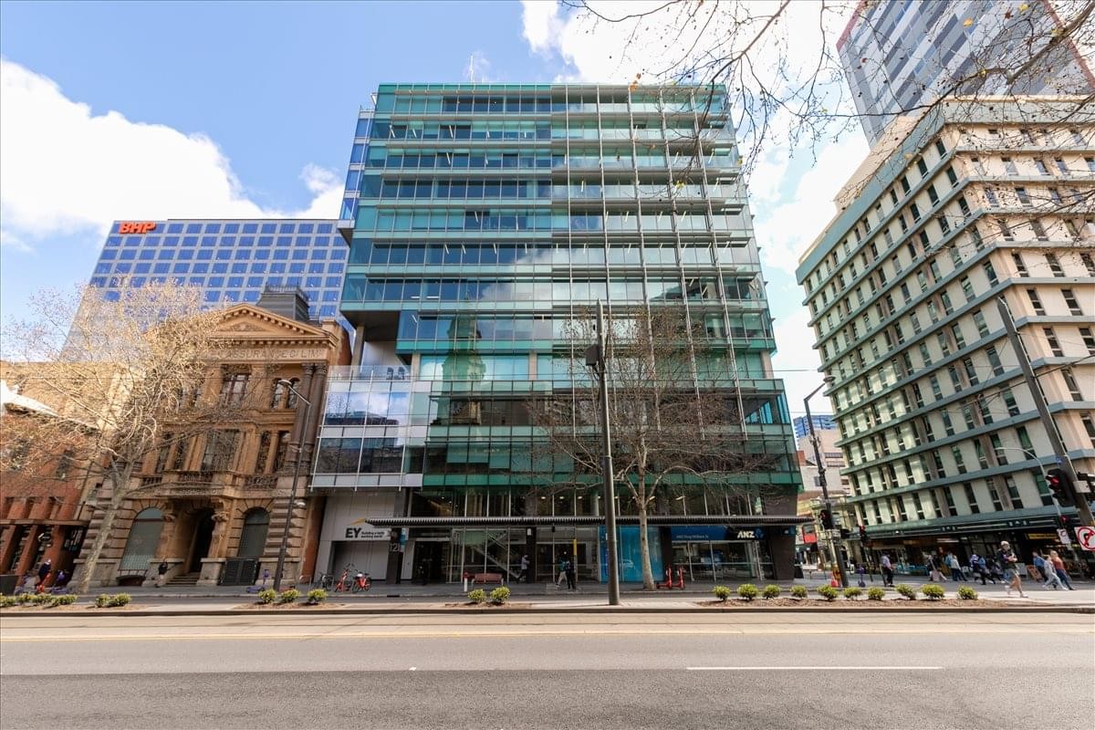 Exterior view of the multi-story glass facade building at 121 King William Street.