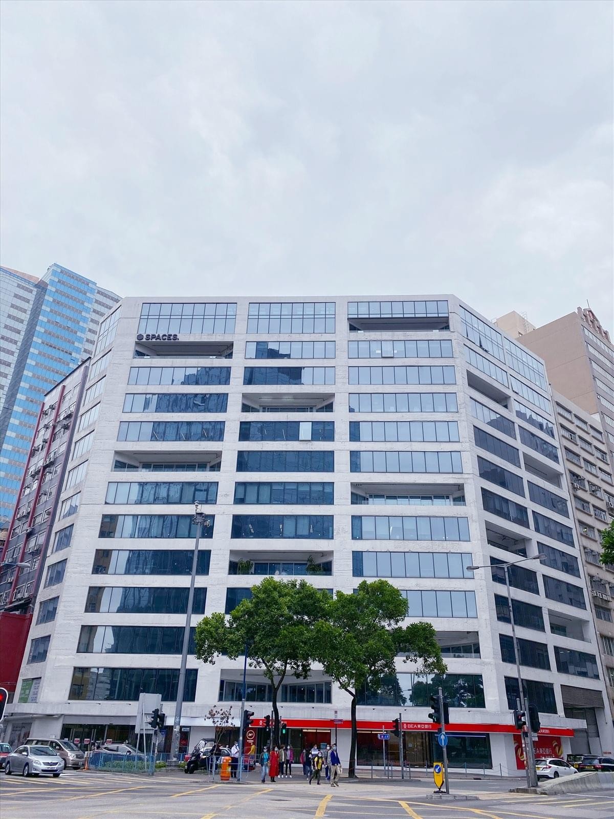 Exterior view of the modern glass and concrete facade at The Grid, 133 Wai Yip Street.
