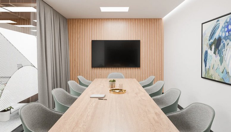 A professional boardroom at 14-16 Yarra Street, Level 1 with a wooden feature wall and light timber table.