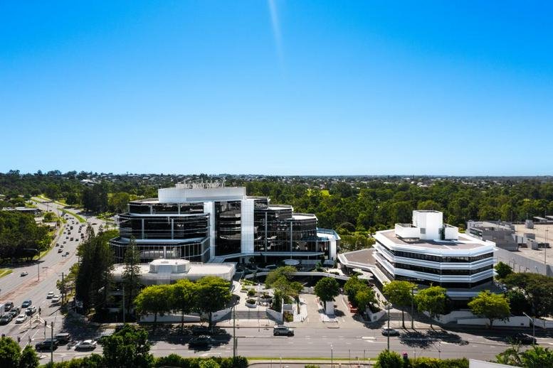 Aerial exterior view of the modern glass-fronted office building at 14 Banfield Street.