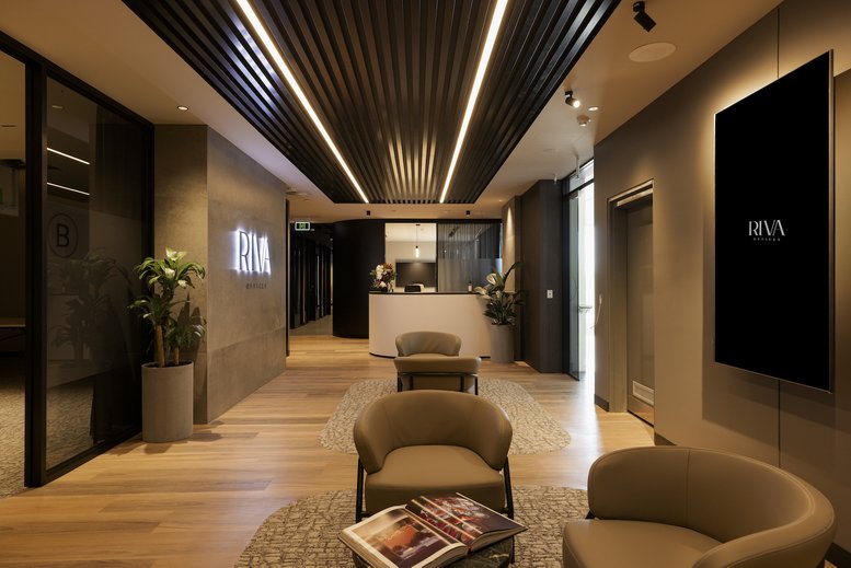 Spacious reception and waiting area at 14, Edgewater Court, Gold Coast with wood floors and modern lighting.