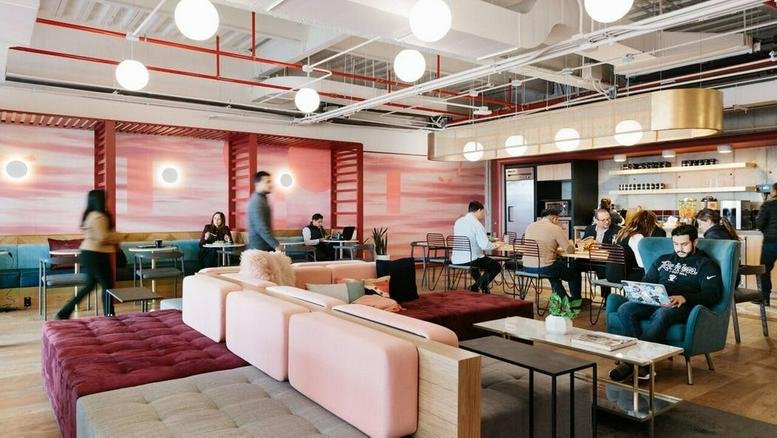 Spacious communal lounge at ISLEX Hongdae, 147 Yanghwa-ro, featuring pink velvet seating and warm globe lighting.