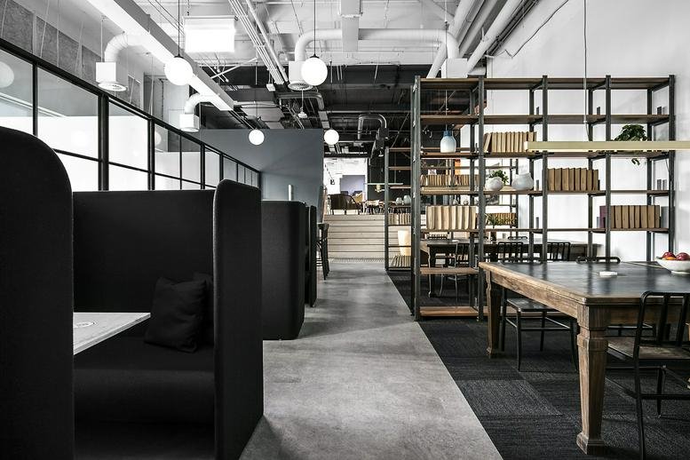 Modern interior common area at Barrack Place, 151 Clarence Street featuring private black acoustic booths.