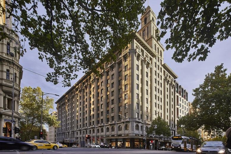 Grand historic stone facade and clock tower of 161 Collins Street, Melbourne.
